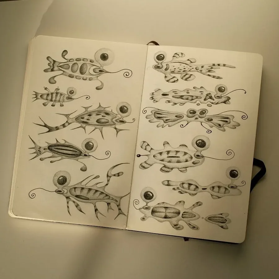Sketchbook page of imaginary creatures